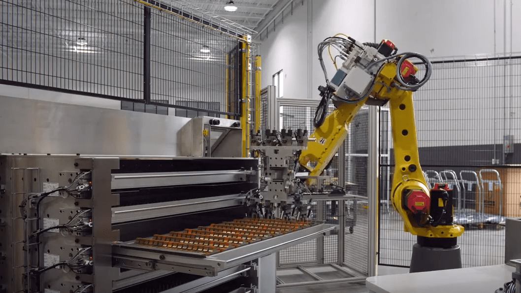 FANUC robot arm working to pick small parts