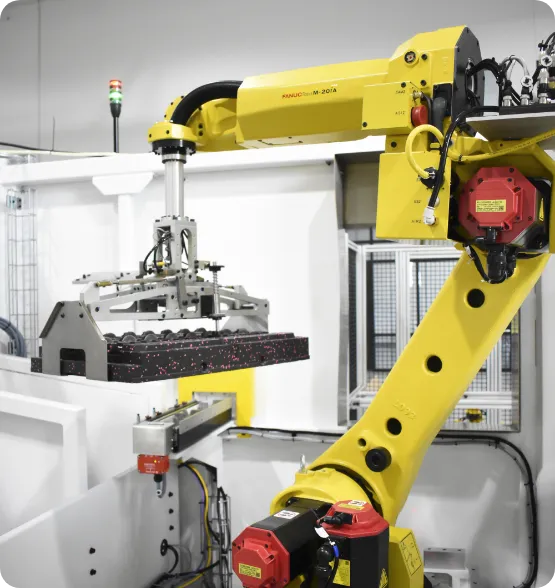 FANUC robot arm lifting heavy object