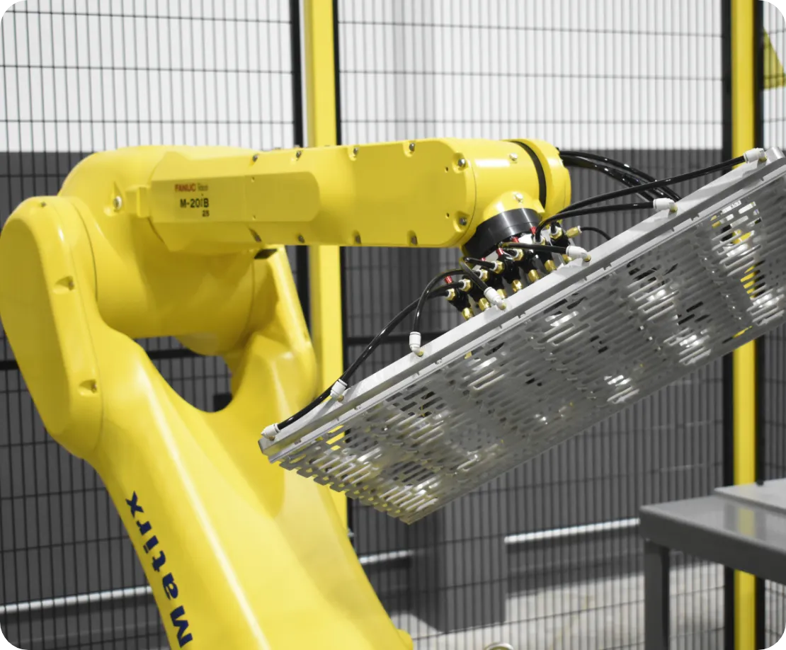 FANUC robot arm holding tray