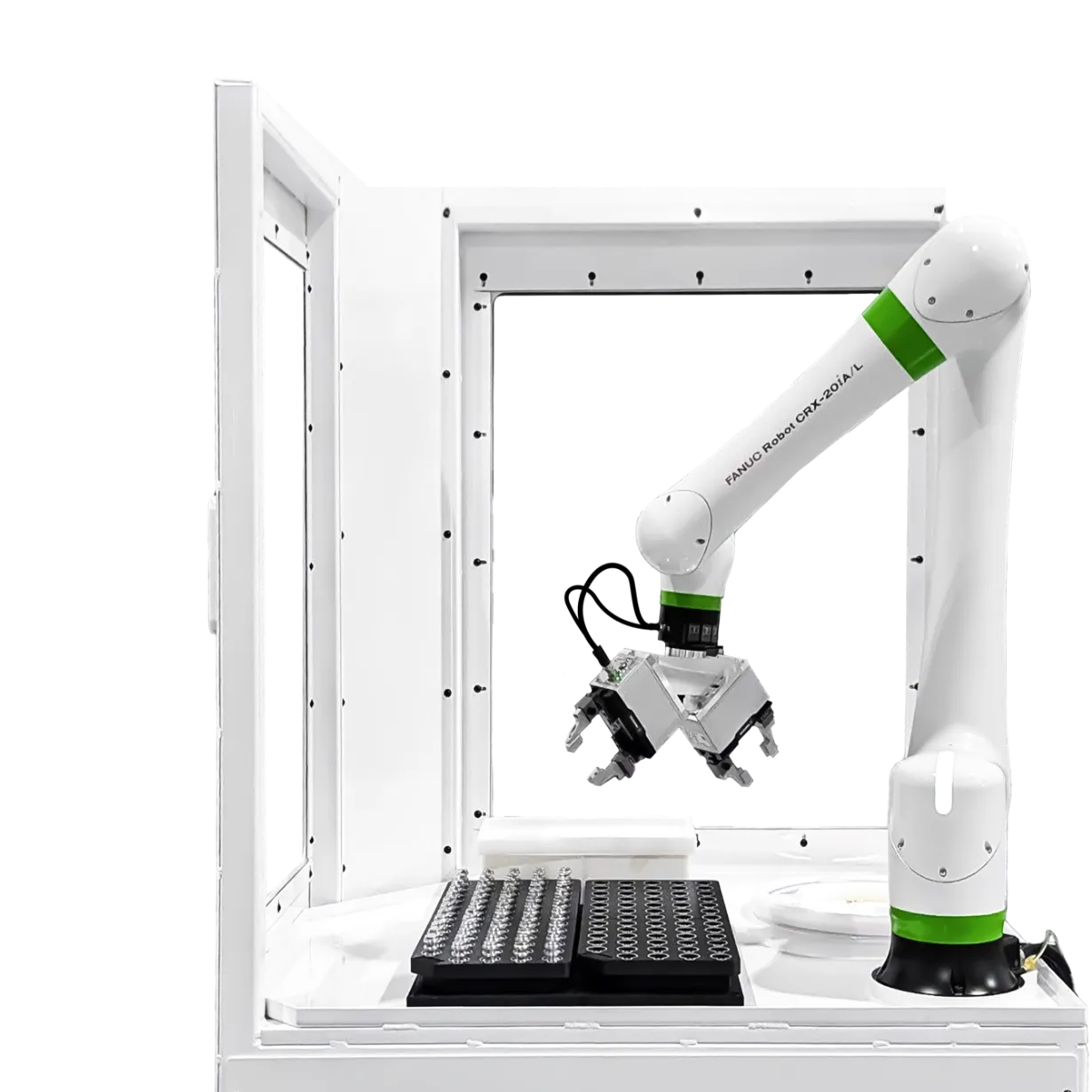 Industrial robotic arm inside a white lab enclosure, gripping a microplate rack at the workstation.